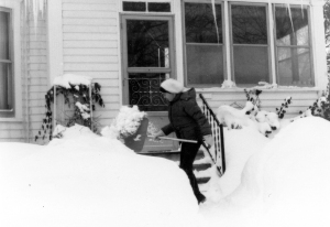 During the Winter of 1979, it got hard to throw the snow high enough to get it over the banks already on the ground. My daughter Melissa is trying her best in this shot, taken at the Matile Manse.