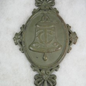 Bronze medallions like this denoted Chicago Telephone Company equipment. The CTC was part of the fast-growing Bell Telephone system.